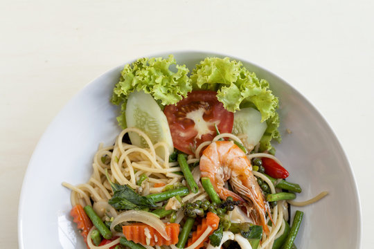 Closeup Thai style fried spaghetti with spicy seafood 