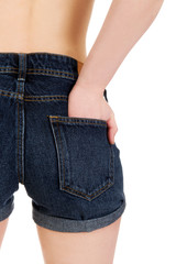 Woman's back in jeans shorts.