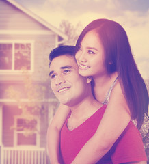 Happy couple near new house