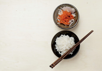 Rice and vegetable salad on wooden table
