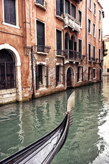 Fototapeta na wymiar Prow of a Venetian gondola on a rainy day