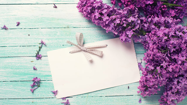 Postcard with  lilac flowers and empty tag