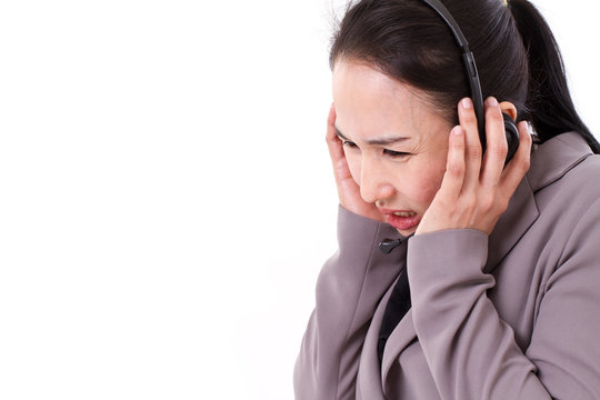 sad, unhappy customer service staff with headset, concept of wor