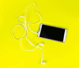 white earphones for using with digital music or  smart phone