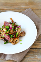 Mushrooms and onions on a plate