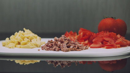 Tomato, sausage and cheese sliced
