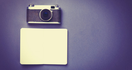 Vintage camera and classic notebook