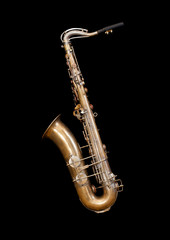 Fototapeta na wymiar Vintage saxophone on black background