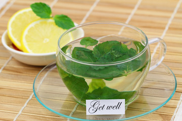 Get well card with cup of mint tea and lemon
