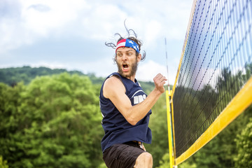 Beachvolley ball player celebrates success