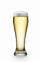 Light beer into glass isolated on white
