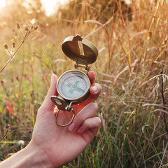 Compass in hand outdoor © Sensay