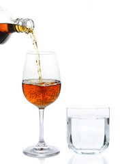 pour whisky into glass and drinking water