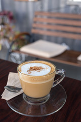 capucino coffee on wood background