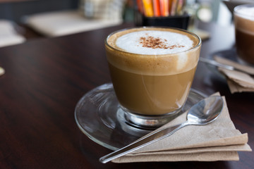 capucino coffee on wood background