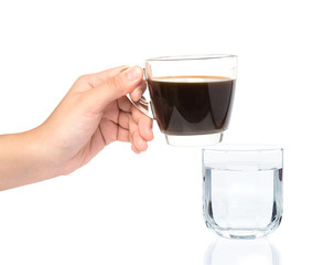 female hand holding cup of coffe with drinking water