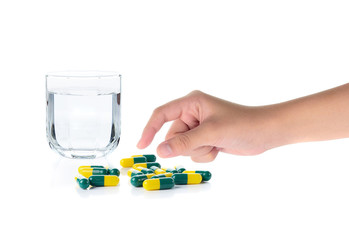Drug capsules and drinking water on white background - 84253011