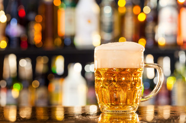 Jug of beer served on bar counter
