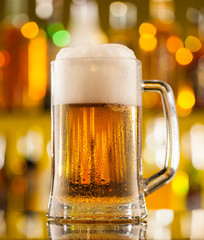 Jug of beer served on bar counter