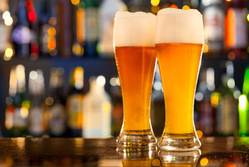Jugs of beer served on bar counter