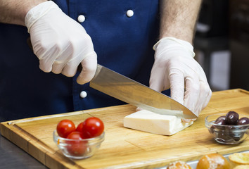 cook prepares canapes in the kitchen at the restaurant