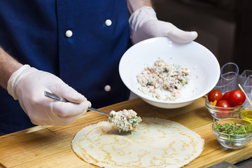 cook prepares canapes in the kitchen at the restaurant