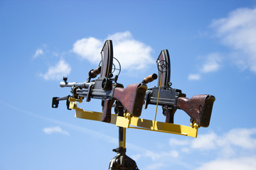 machine gun on a stand against the sky