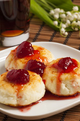 Homemade cottage cheese pancakes with strawberry jam, selective