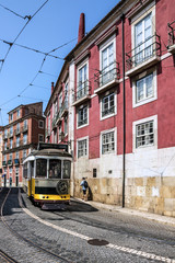 Fototapeta na wymiar Old tram 28 on the street of Lisbon, Portugal.