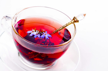 Cup of tea with teabag over white