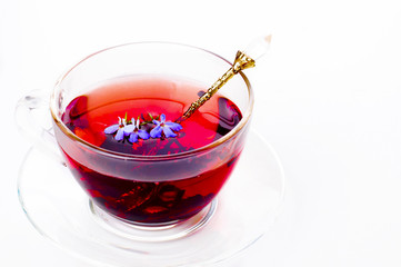 Cup of tea with teabag over white