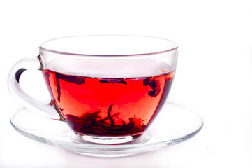 Cup of tea with teabag over white