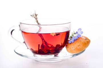 Cup of tea with teabag over white