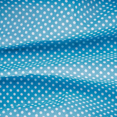 closeup of blue polka dot fabric