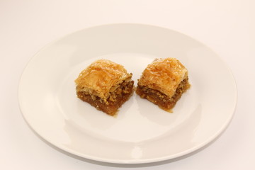 Traditional Turkish Ramadan dessert baklava on a white plate