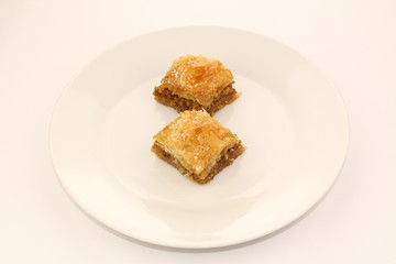 Traditional Turkish Ramadan dessert baklava on a white plate