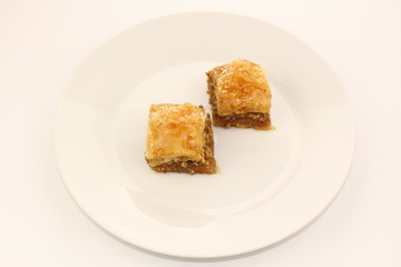 Traditional Turkish Ramadan dessert baklava on a white plate