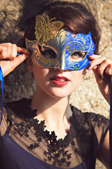 Brunette with venetian mask