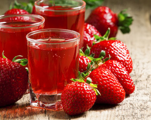 Clear fresh cold strawberry juice, selective focus