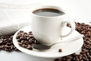 Cup of coffee with newspaper at breakfast