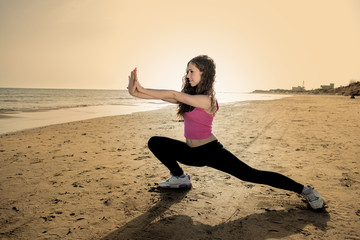 Fototapeta na wymiar fitness and sport concept with young woman making exercises