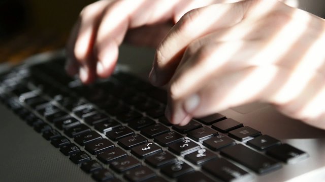 typing on a laptop
