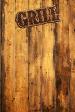 plaque "grill" hanging by a wooden wall