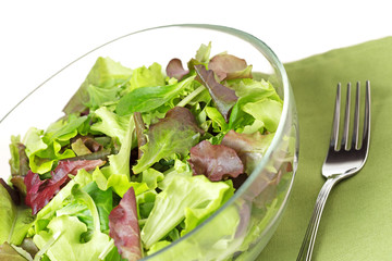 mixed salad, fork and napkin
