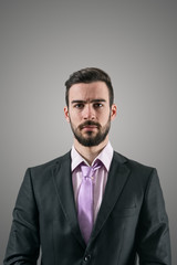 Dramatic portrait of serious businessman intense look at camera 