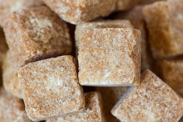 Rushy raw sugar cubes close up
