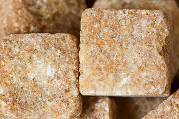Rushy raw sugar cubes close up