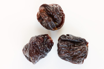 Prunes on a white background