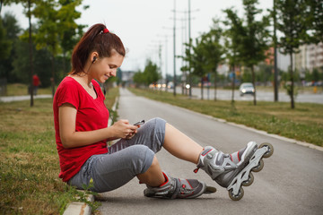 Sporty girl using phone