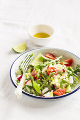 vegetable salad with pasta in a vintage plate 